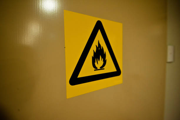 istock Dangerous Material. Risk OF Fire And Flame Warning Sign On A Wall 950484974