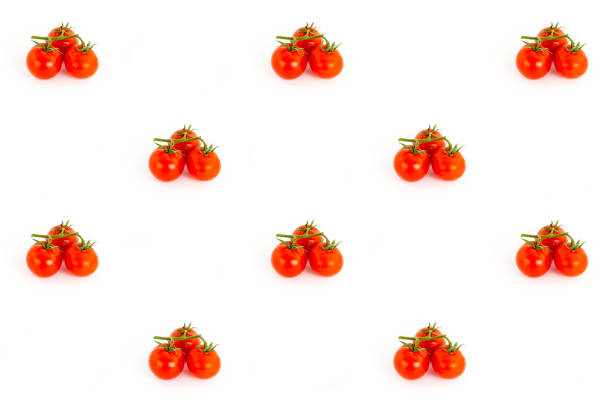 three small tomatoes red cherry branch, group of berries on a white background pattern contrasting juicy base design