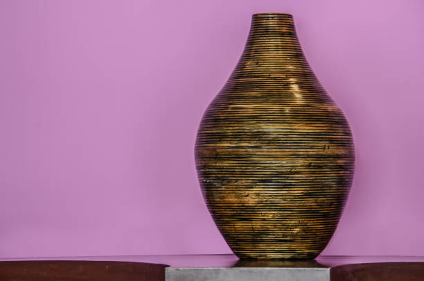 black clay pot closeup on white background