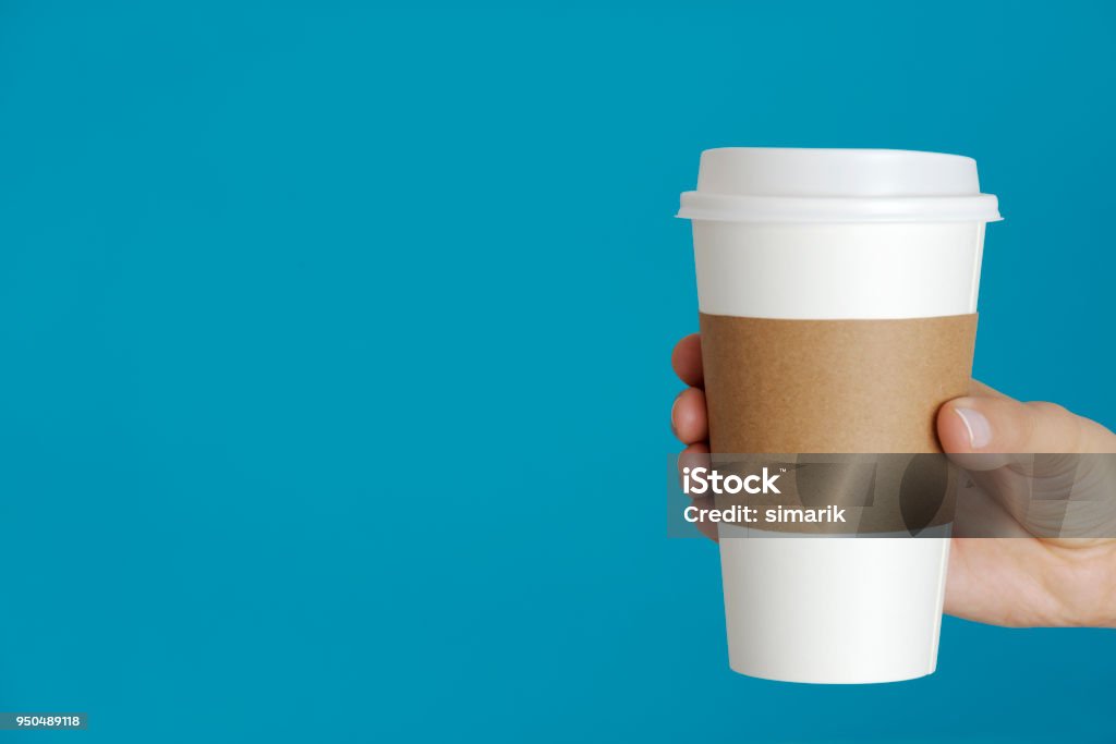 Hot Drink Caucasian female is holding a disposable cup in hand. Coffee - Drink Stock Photo