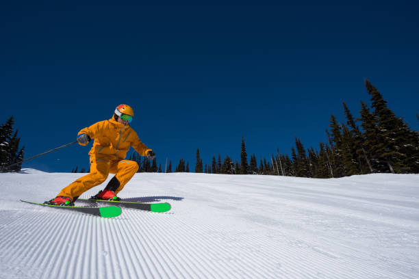 istock Skiing groomed runs on a sunny day 950489840