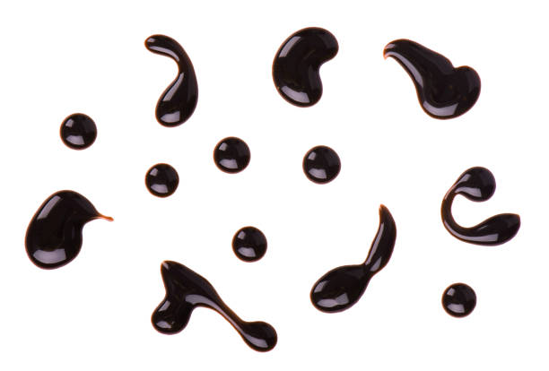 istock Chocolate syrup drop isolated on white background. Top view 950498860