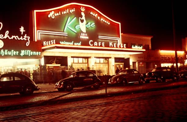 St. Pauli, Hamburg, Germany, 1958. The Cafe Keese on St. Pauli at night. Furthermore: cars, neon signs and passers-by.
