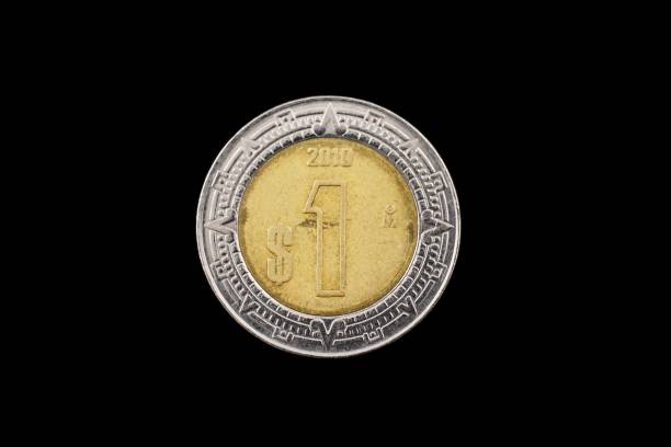 istock Mexican One Peso Coin Isolated On A Black Background 950499536