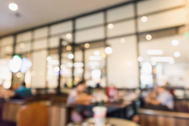 istock Restaurant cafe or coffee shop interior with people abstract defocused blur background 950510890