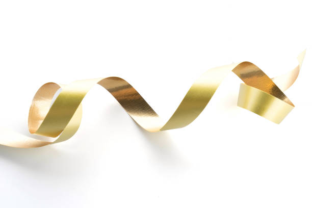 istock Golden ribbon roll isolated on white background 950511172