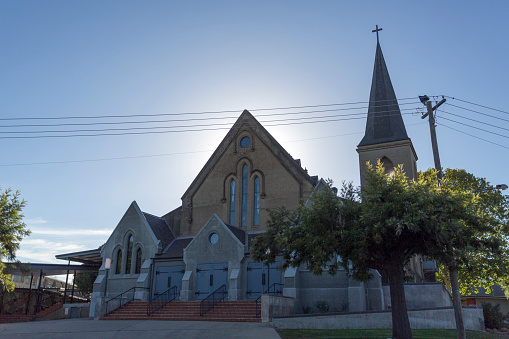 View of the St John Evangelist Anglican Church, a Victorian Gothic Revival building with Federation Gothic alterations, in the city of Wagga Wagga, New South Wales, Australia.