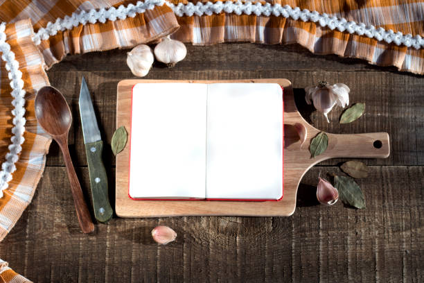 istock Recipe book with space for writing on a cutting wooden Board 950519082