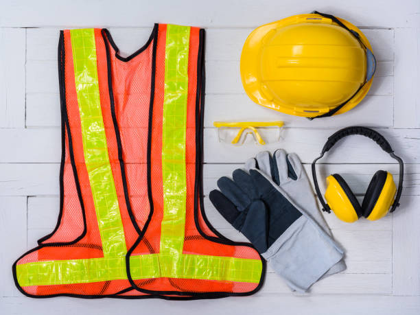 istock Standard construction safety equipment on wooden table. top view 950523458