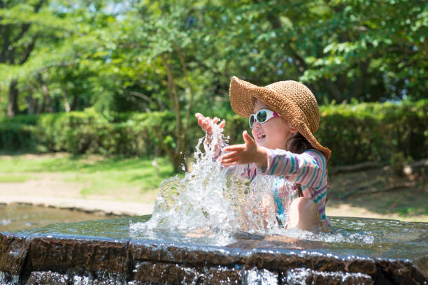 Little girl playing water