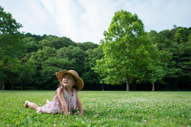 istock Little girl playing on the meadow 950546670