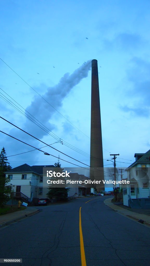 Working-class district at the foot of the chimney Sudbury chimney in the centre of a working-class neighbourhood Sudbury - Canada Stock Photo