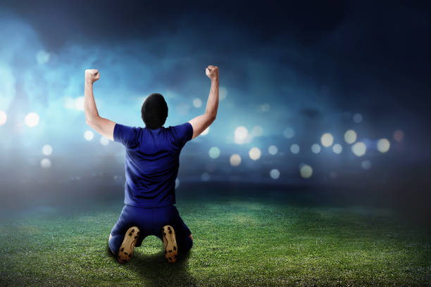istock Rear view of asian soccer player with happy expression 950554482