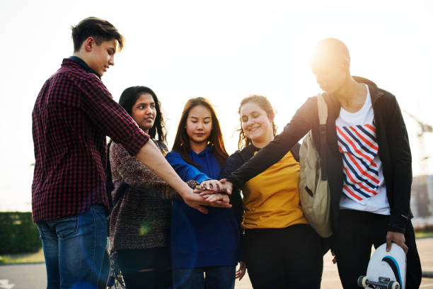 istock Group of friends hands stacked together support and teamwork concept 950555814