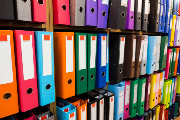 istock Colorful folders on the bookshelf at office 950558440
