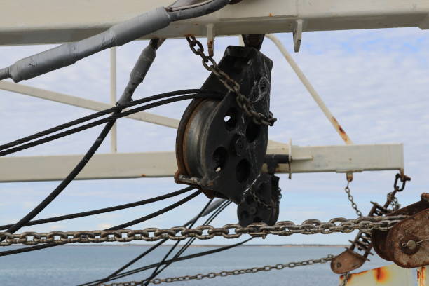 istock Commercial fishing boat rigging pulley and chains 950559090
