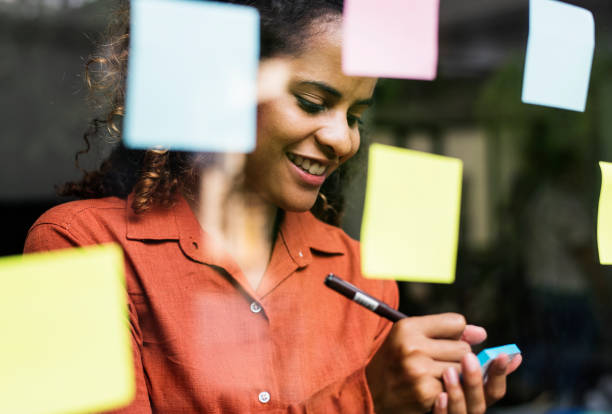Businesspeople brainstorming with creative ideas Businesspeople brainstorming with creative ideas mirror writing stock pictures, royalty-free photos & images