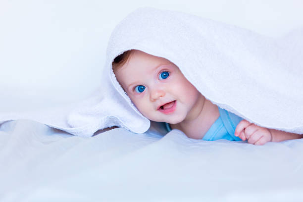 istock Little child boy with blue eyes 950560730