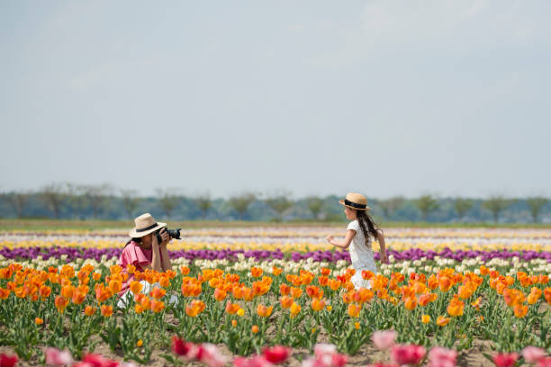 istock Mother and daughter taking pictures 950564084