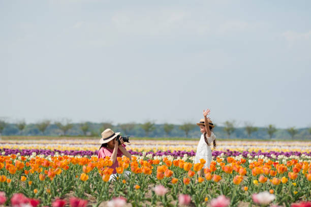 Mother and daughter taking pictures