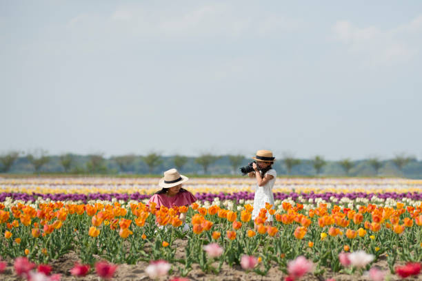 istock Mother and daughter taking pictures 950564118