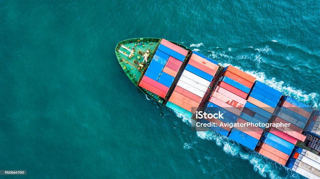 Aerial top view container cargo ship, Business logistic and transportation of International by ship in the open sea. Container Ship Stock Photo