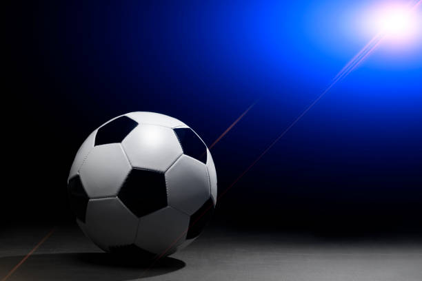 istock Soccer ball on the black background 950565342