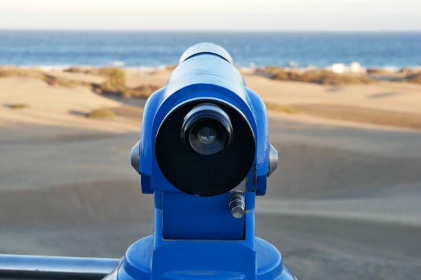 istock Binoculars - Telescope - on the beach - straight ahead 950573226