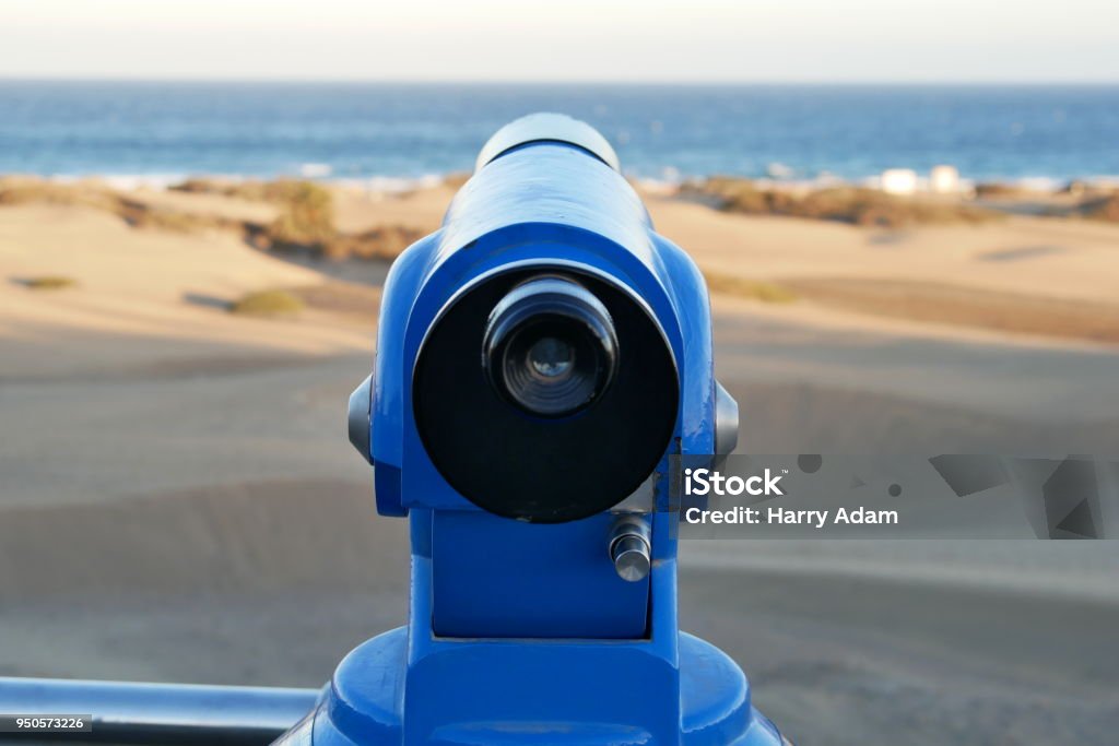 Binoculars - Telescope - on the beach - straight ahead Binoculars - Telescope - on the beach - straight ahead - close up Beach Stock Photo