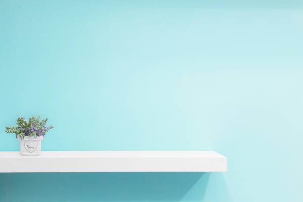 istock Empty white shop shelf, retail shelf on blue vintage background. 950573508