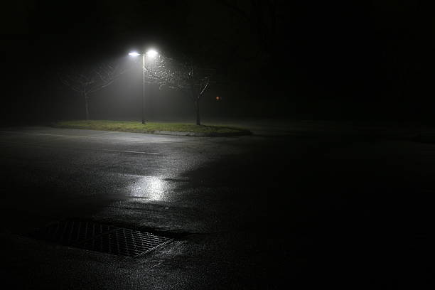 istock Foggy night-time parking lot 95057734