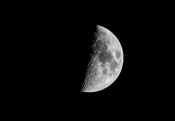 half moon in a black night sky Gorgeous half moon just before Vesak in a black night sky apollo 11 stock pictures, royalty-free photos & images