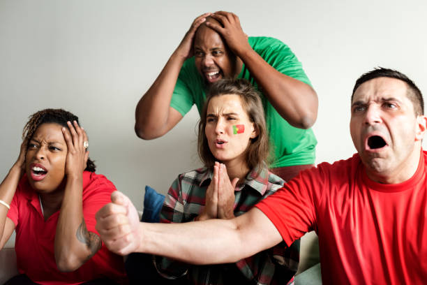 istock Friends cheering world cup with painted flag 950581540