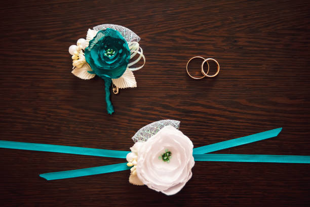 istock Gold wedding rings lie on a wooden table 950587144