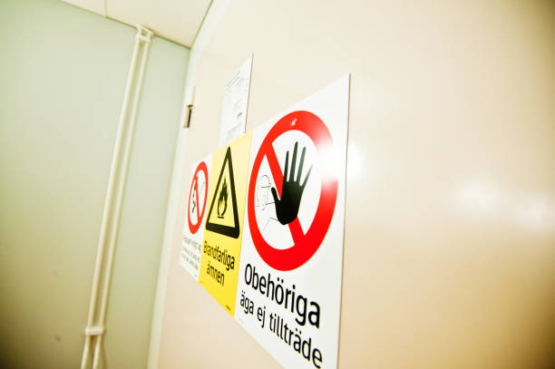 istock No Smoking, Dangerous & Flammable Material And Stop! Unauthorized Access Not Allowed Warning Signs On A Door (in Swedish) 950589370