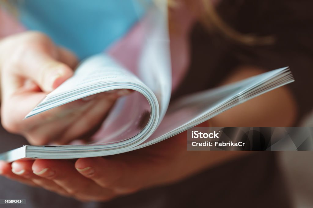 woman reading magazine at home Magazine - Publication Stock Photo