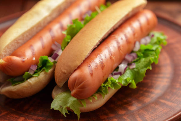 istock Hot dogs on wooden background 950593912