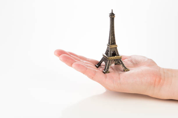 Eiffel Tower miniature with male hand