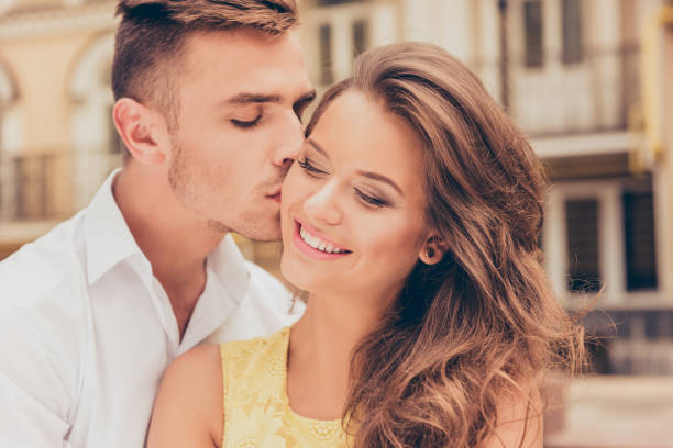 istock handsome young man kissing his beloved 950597162