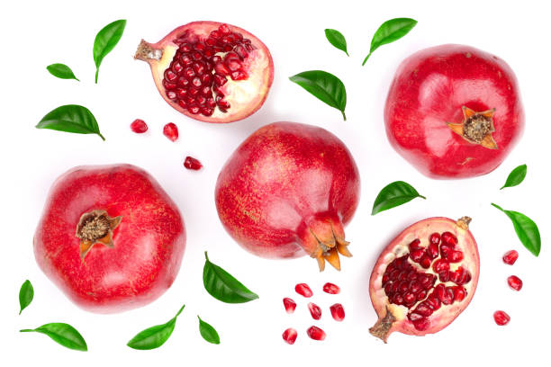 istock pomegranate with leaves isolated on white background. Top view. Flat lay pattern 950597458