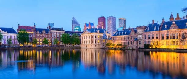 Panoramic View of The Hague Downtown City Skyline and Parliament Buildings at Twilight, Netherlands Reflection in the still waters of the lake the hague stock pictures, royalty-free photos & images