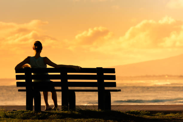 istock Girl relaxing and watching sunset 950598322