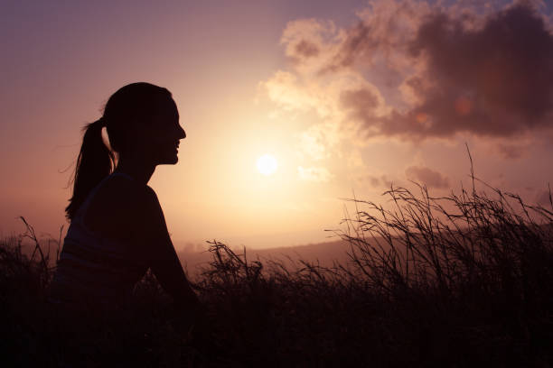 istock Young woman outdoors watching the sunset 950598484