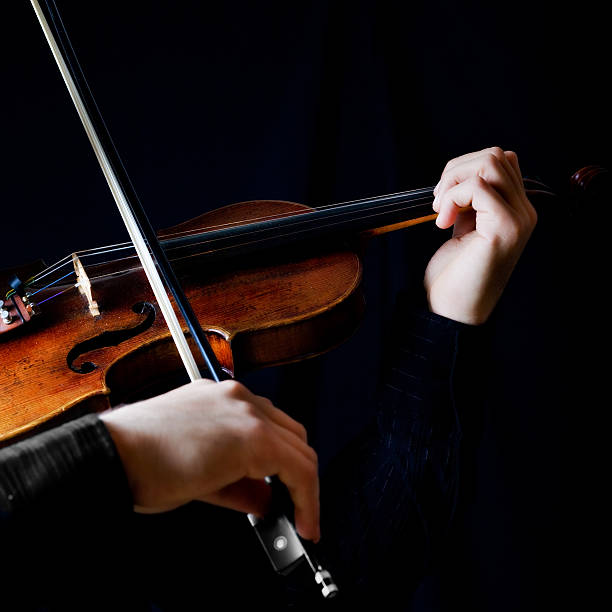 istock Photo of violin player on black background 95059863