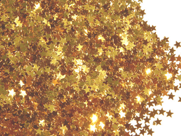 Macro photograhy of golden glitter.