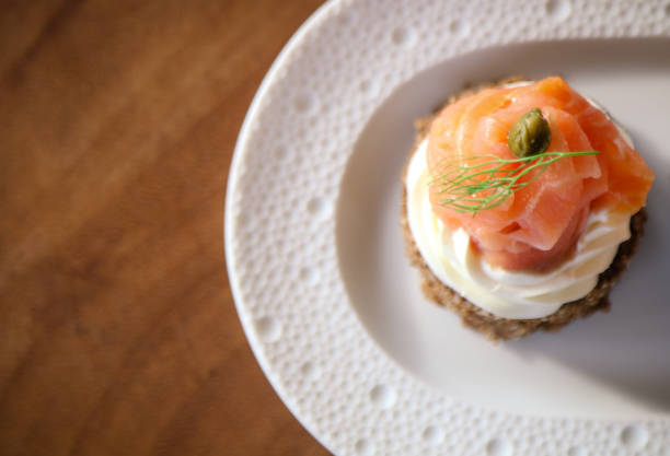 istock Smoked salmon with cream cheese on bread 950599972
