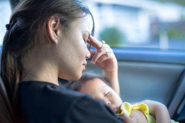 istock Tired stressed mother holding baby 950601438