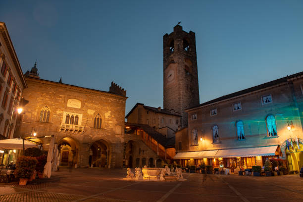 Bergamo old square with fountain and tower in bergamo bergamo stock pictures, royalty-free photos & images