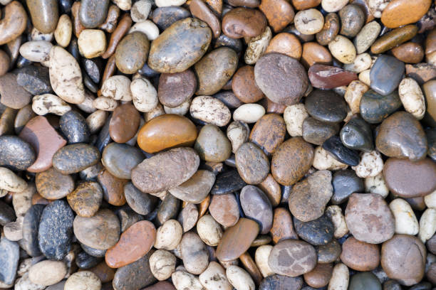 istock Stone pebbles texture or stone pebbles background. stone pebbles for interior exterior decoration and industrial construction concept design. stone pebbles motifs that occurs natural. 950603680