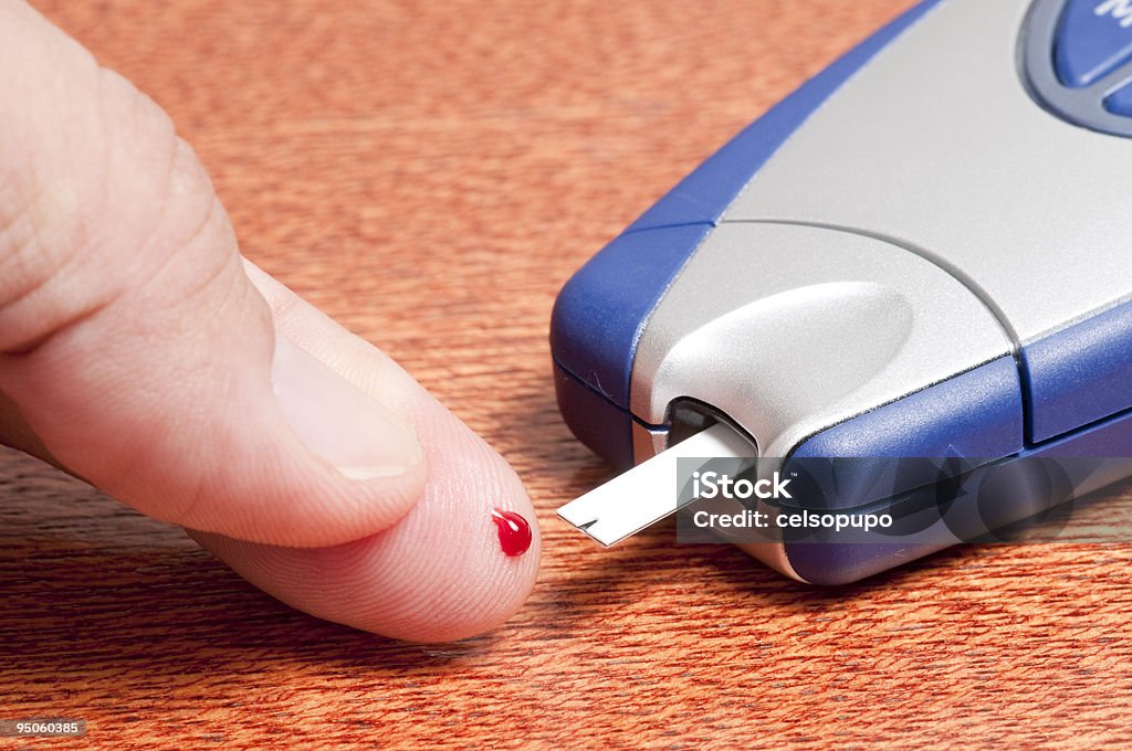 Finger test People making a finger test in a glucometer Analyzing Stock Photo